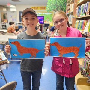 Children making crafts during a library activity