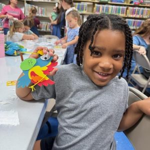 Children making crafts during a library activity