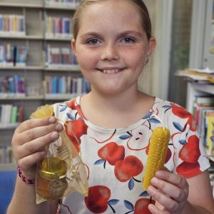 Children making crafts during a library activity