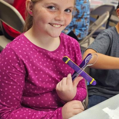 Children making crafts during a library activity