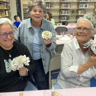 Library patrons participating in an arts and crafts activity