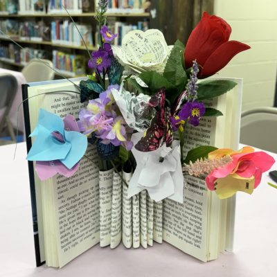 Handmade floral centerpiece created from recycled book pages